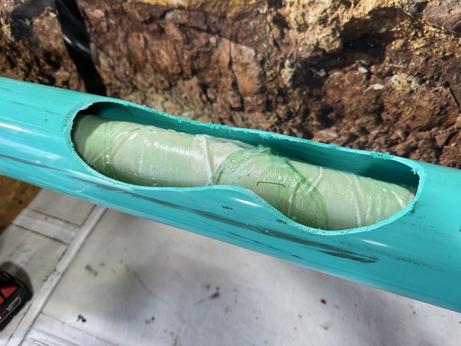 Sewer Pipe Repair Resin-coated fiberglass liner inside a sewer pipe repair sample
